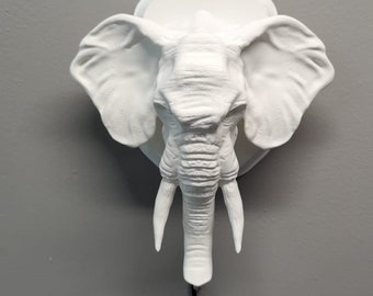 Elephant-inspired wall trophy lamp to decorate your room: bedroom, game room or office.