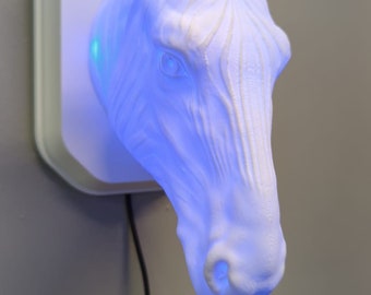 Zebra-inspired wall trophy lamp to decorate your room: bedroom, game room or office.