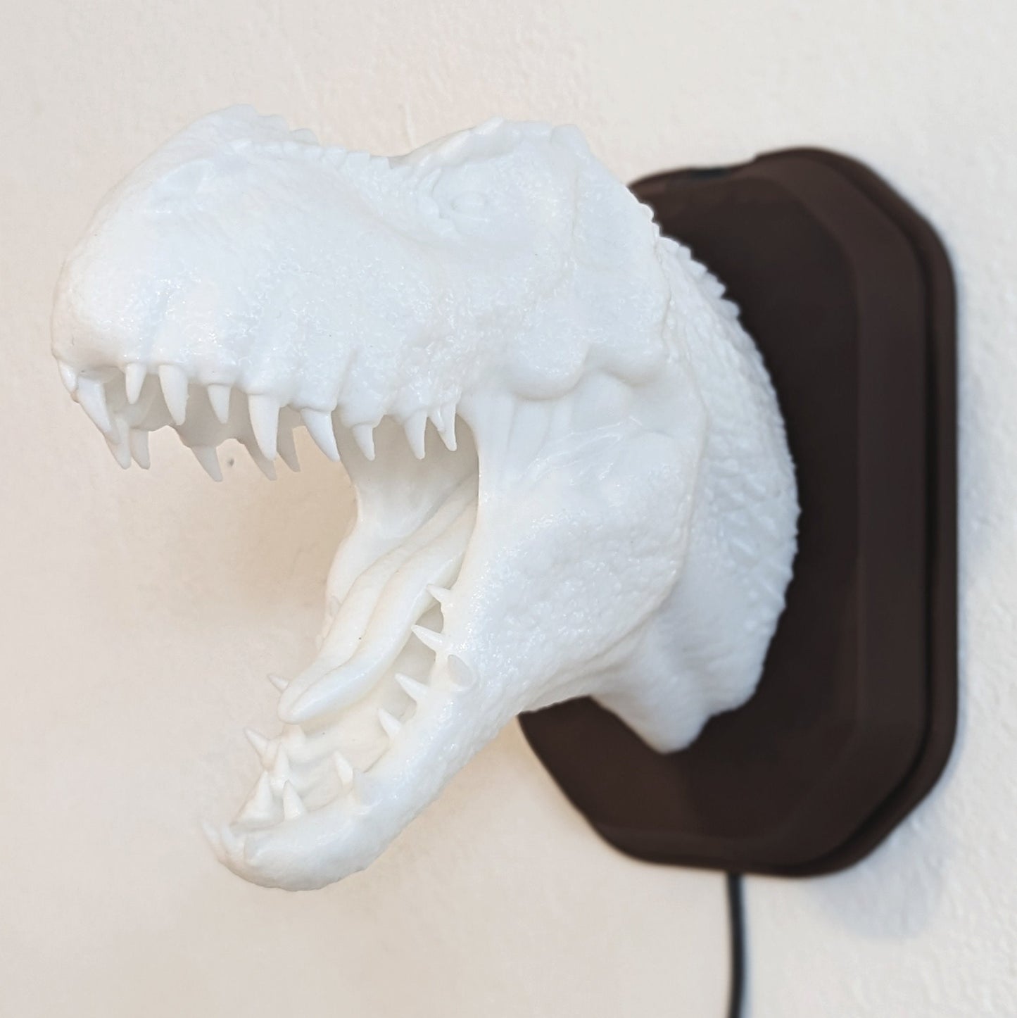Tyrannosaurus rex T-Rex inspired wall trophy lamp to decorate your room: bedroom, playroom or office.