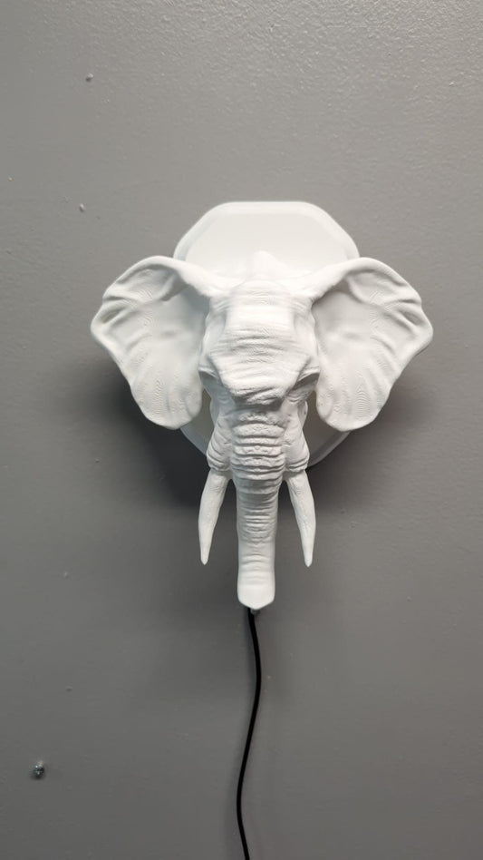 Elephant-inspired wall trophy lamp to decorate your room: bedroom, game room or office.